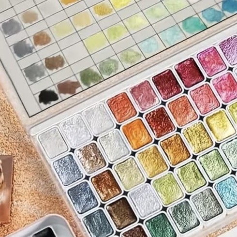A large pearl watercolour set, rows of shimmering metallic pans